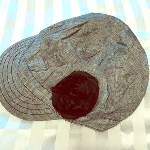 Gray French hat with black flower